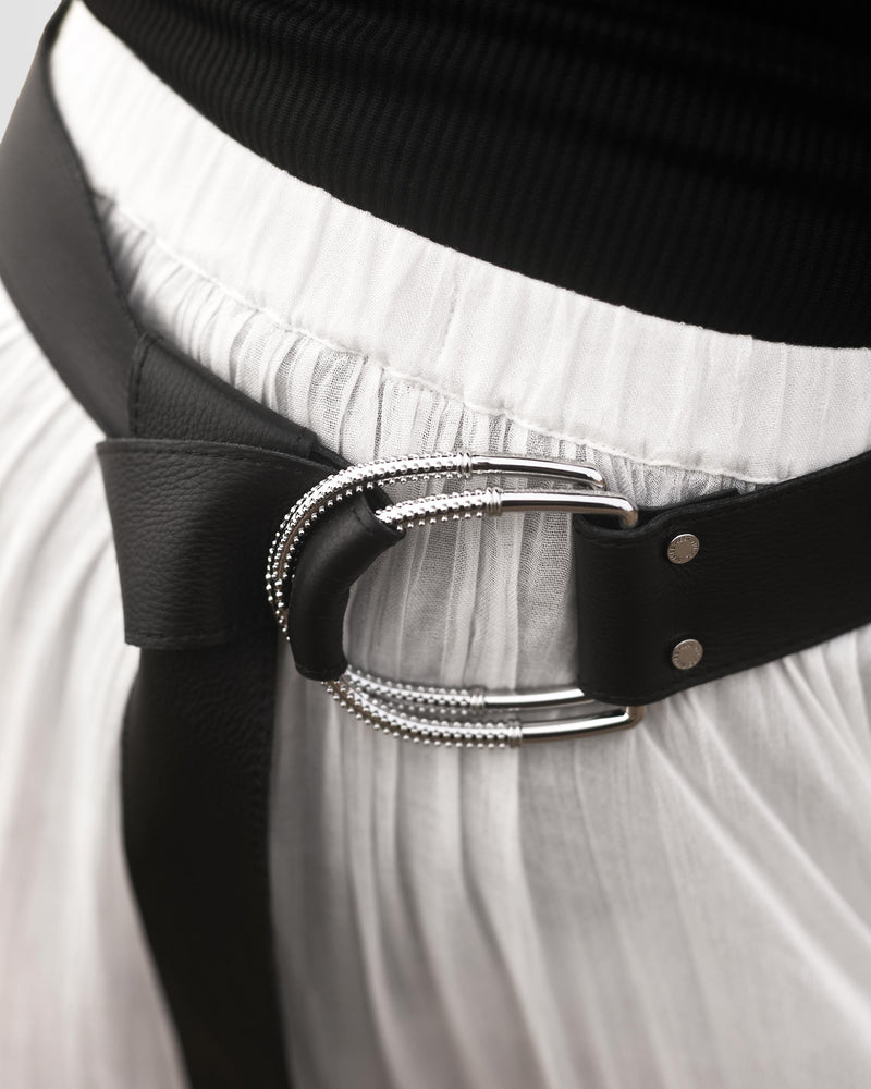 Wrap Me Leather Belt in Black, showing buckle detail on model with wrap knot 